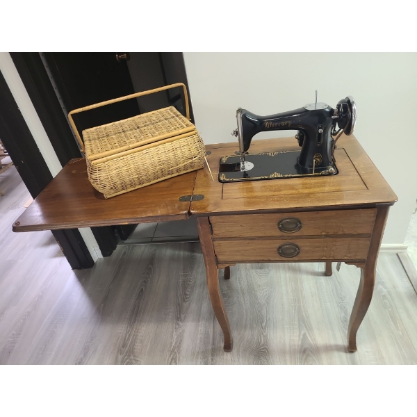 Hide-away vintage Mercury sewing machine with basket and contents 