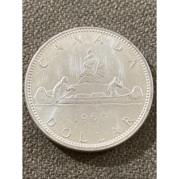 1965 Canadian Silver Dollar Featuring Canoe Design and Queen Elizabeth II Portrait