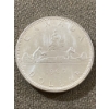 Image 1 : 1965 Canadian Silver Dollar Featuring Canoe Design and Queen Elizabeth II Portrait