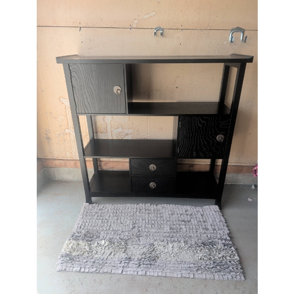 Black Wooden Storage Unit With Shelves, Cabinets, and Drawers