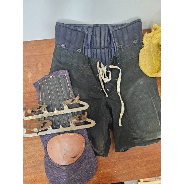 Vintage Hockey Equipment Set Including Pads, Gloves, and Shorts