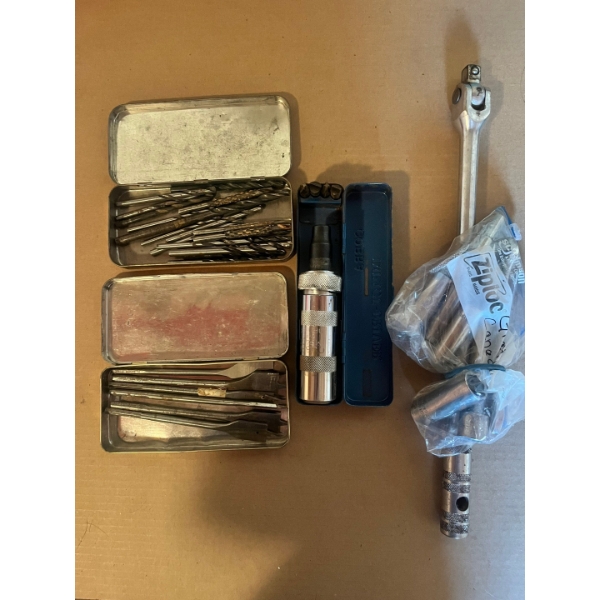 Gray Canada socket set, cobra impact, variety of drill bits and spade drill bits. 