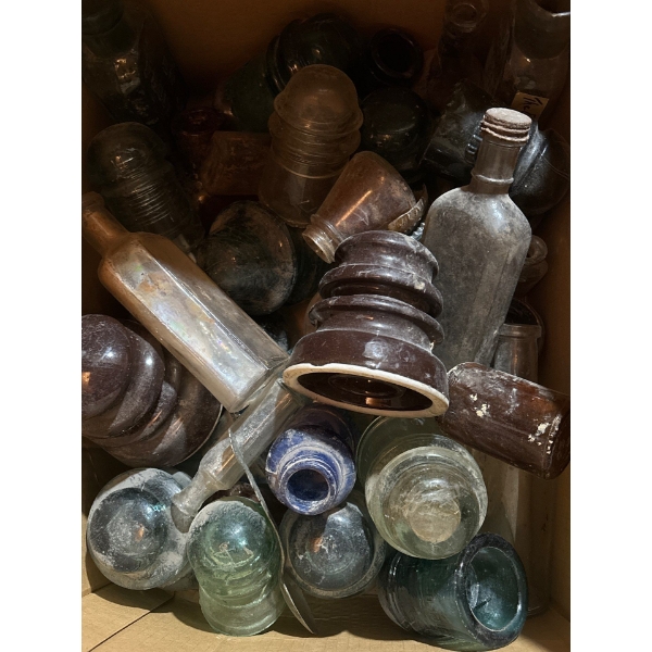 box full of un research medicine bottles, and a variety of insulators 