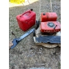 Image 1 : Lawn Boy lawnmower, gas jug, and homemade manual chainsaw. A true handyman special. 

