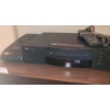 Image 3 : RCA VHS Player with Remotes on Wooden Media Stand