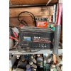Image 2 : entire shelf full of goodies battery charger antique motor lubricant tape filter filters hammer saw 