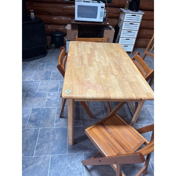  Oak table with four teak chairs, and one extra antique wooden chair L 29 inches width 47” Height 29