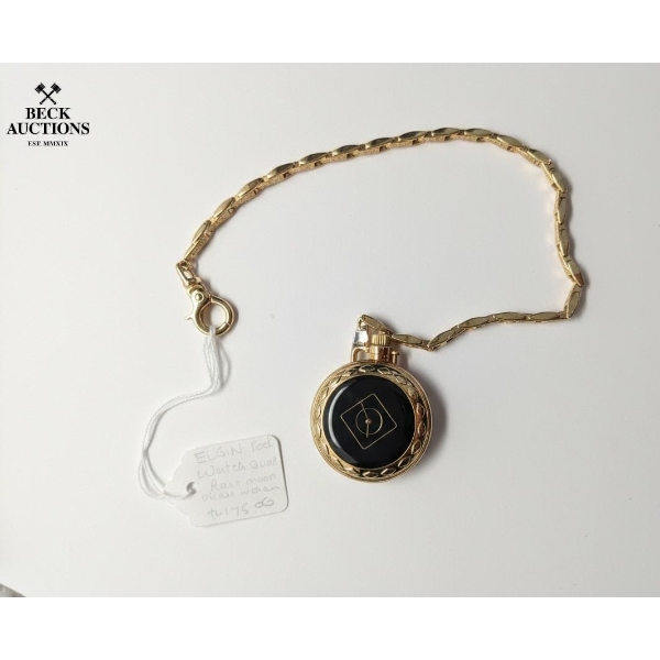 Elgin Pocket Watch With A Matching Gold-Toned Chain And A Distinctive Black Face Design.