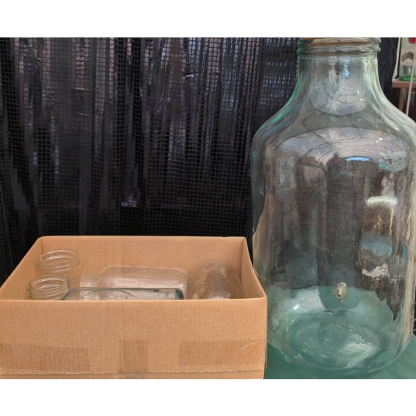 Large Glass Jar With Cork Lid and Four Assorted Mason Jars
