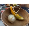 Image 4 : Marble fruits and vegetables, basket with plastic vegetables, chili pepper dish, and a vintage clay 