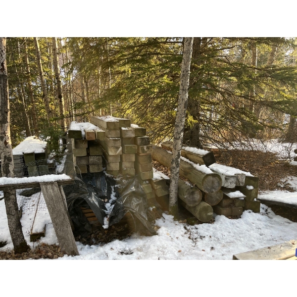 large pile of Pressure Treated Posts 4x6=36 6x8 =10