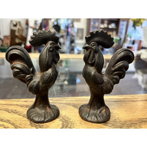 Miniature vintage cast iron rooster figurines are heavy metal collectibles. 