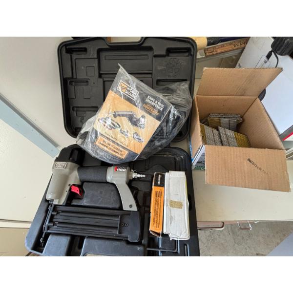 Air Brad nailer with a large box of nails, including a knife and tool sharpener made by Work Sharp
