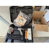 Image 1 : Air Brad nailer with a large box of nails, including a knife and tool sharpener made by Work Sharp

