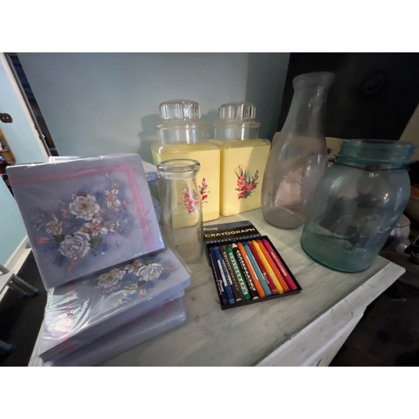 vintage yellow storage containers with three antique jars and milk jugs