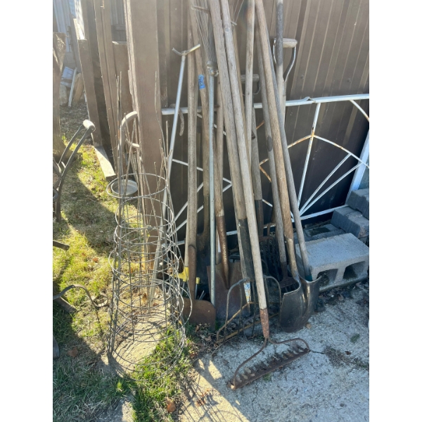 Tomato cages, standup sprinkler assortment of yard, acreage and garden tools.

