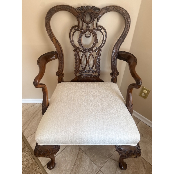Ornate Wooden Armchair with Carved Details and Upholstered Seat
