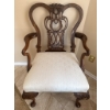 Image 1 : Ornate Wooden Armchair with Carved Details and Upholstered Seat