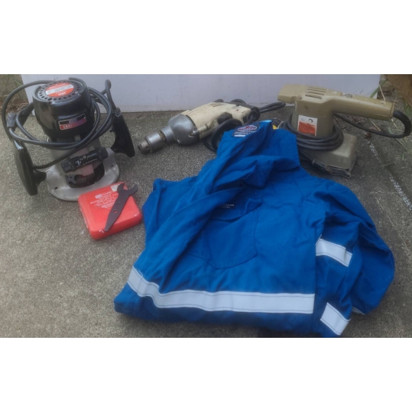 Working Power Tools and Guardian Protective Coveralls XL