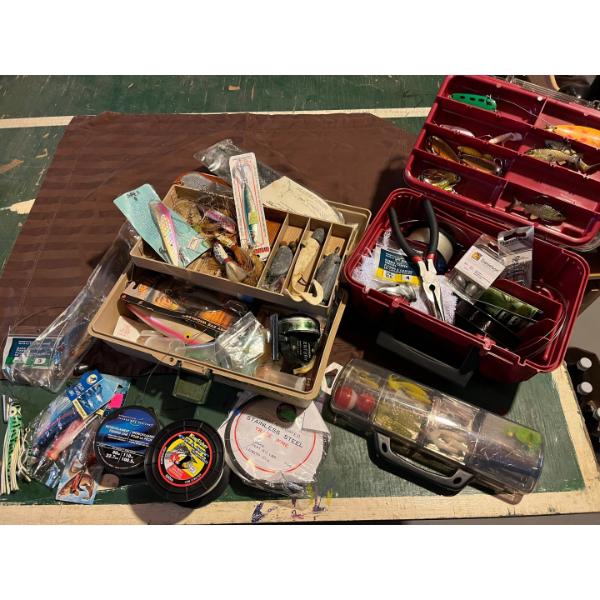 large collection of fishing tackle flies lures with a vintage reel weights all sorts of leaders ever