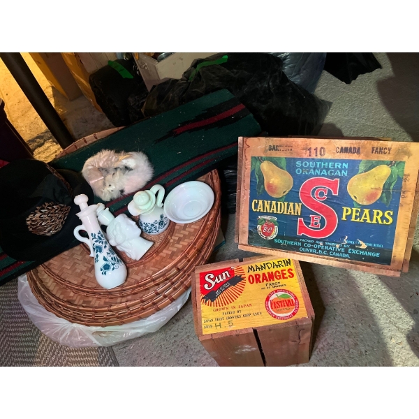  woven green rug, black hat with feathers on the side with a little white Martin hat, trimmer, and s