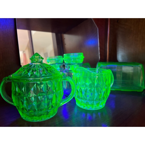 amazing collection of uranium glass, green sugar and creamer, honey bowl butter dish with top and se