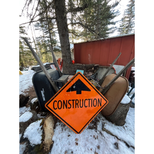 Construction road sign with two wheelbarrows
