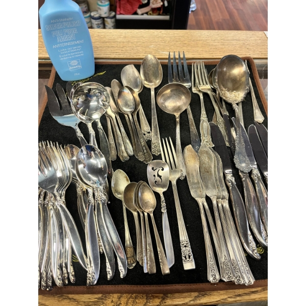 Vintage collection of silverplate flatware, which appears to be in the "White Orchid" pattern

