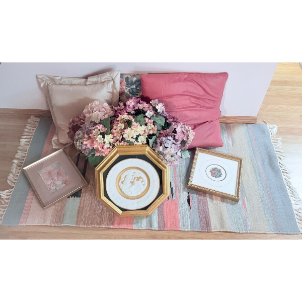 Decorative Home Lot Including Framed Art, Cushions, Rug, and Floral Arrangement