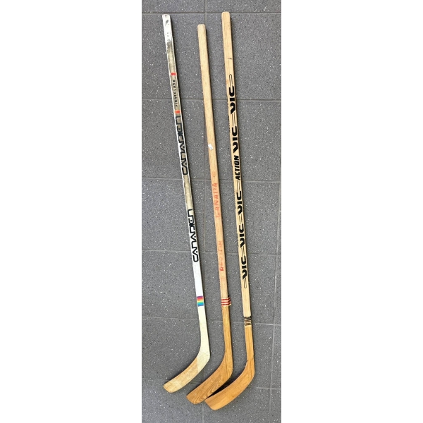 Four Vintage Wooden Hockey Sticks