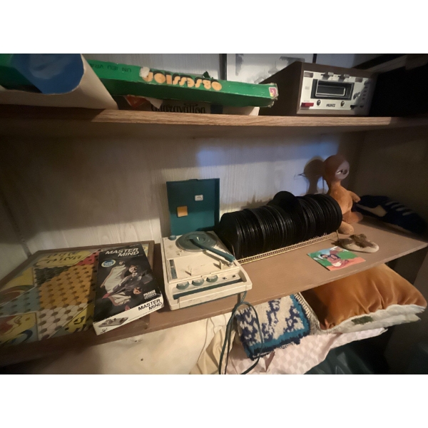 vintage records and vintage record player along with animal stuffed doll.
All records are un researc