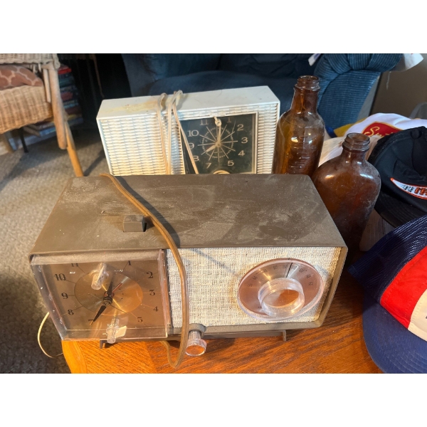 Collection of antique radios bottles, and old school trucker hats