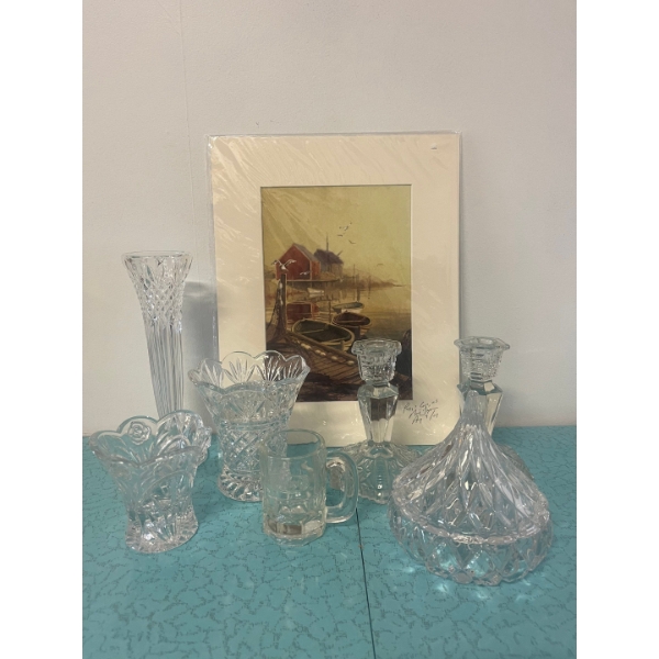 Collection of crystal cut-glass items, toothpick holder, decanter, vase, and candlestick holders. An