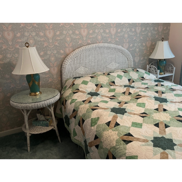 White wicker double bed with two side tables, including glass tops linen and mattress, and lamps not