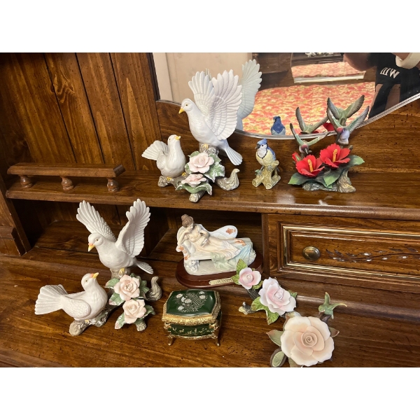  collection of bird sculptures, soft, white, and pink in color