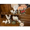 Image 1 :  collection of bird sculptures, soft, white, and pink in color