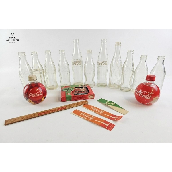 Coca-Cola Contour Designs From The 1940s And 1950s, Alongside Vintage Orange Crush Bottles.