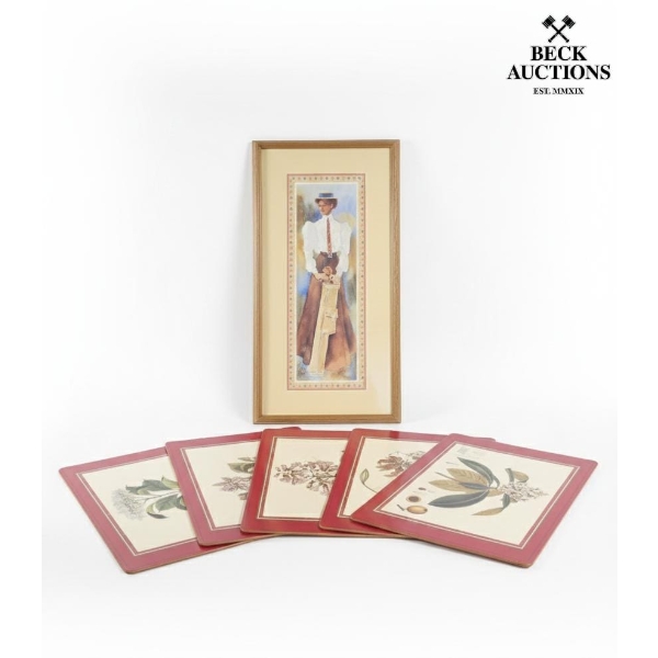 vintage placemats with botanical prints and a framed art print featuring a figure in vintage cricket