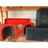 Image 5 : contents of shelf, including a GE garbage disposal, Kenwood speakers, rolling knee cart, laser level