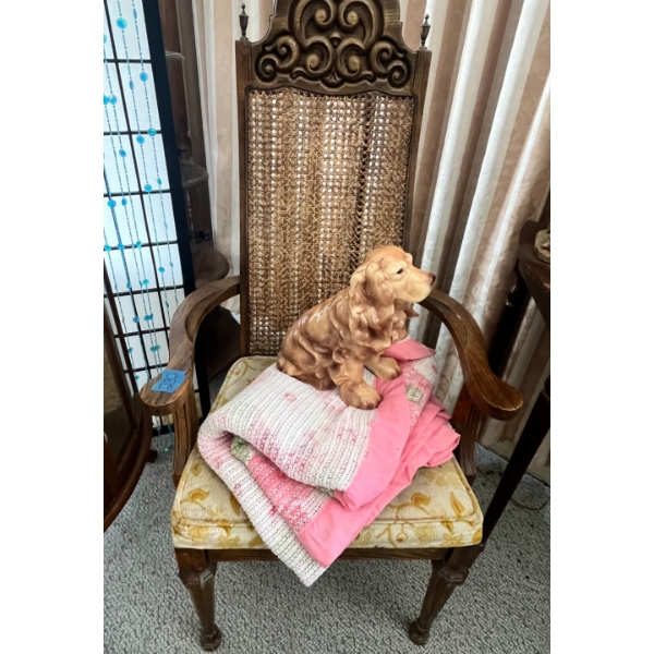 vintage-style carved wooden chair features a cane backrest and an upholstered seat cushion with vint