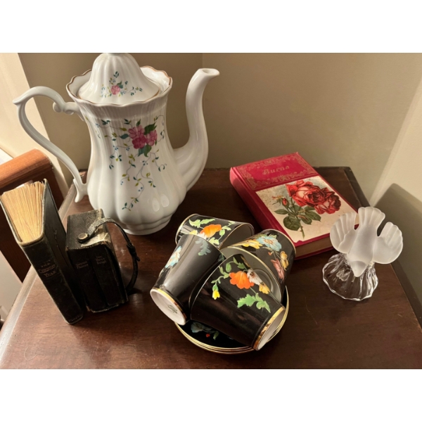 vintage teapot with two small vintage leather bound bibles, and set of for tea, cups, and saucer and