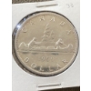 Image 1 : 1959 Canadian Silver Dollar with Canoe Design