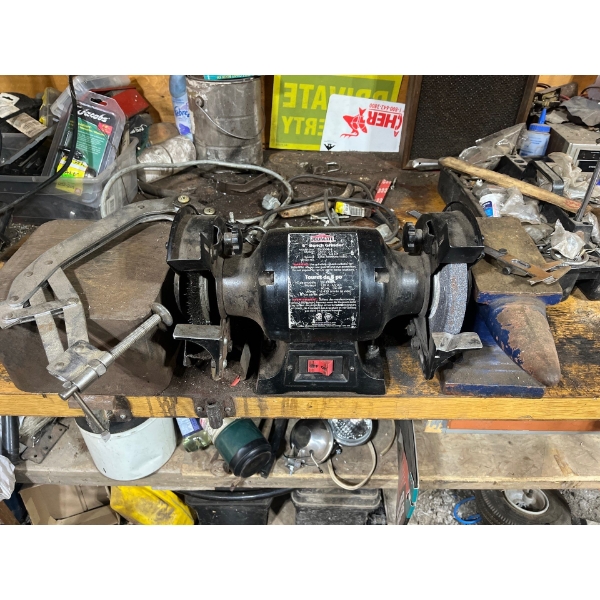 Job mate grinding wheel, caliper, anvil, and a large piece of steel to pound out all your metal
