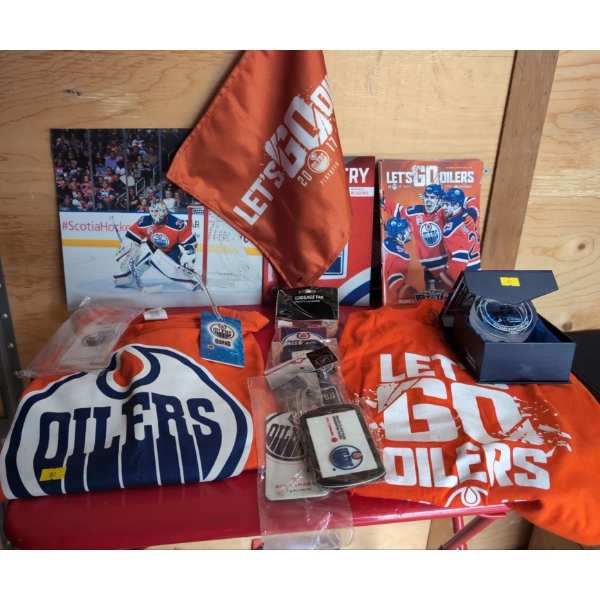 Oilers T-Shirts, Scarves, Luggage tags, Programs and Official game Used Ice