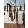 Image 2 : Massive Selection Of Tools Hanging on The Wall . Pipe Wrenches Jackall Saws Extension Cords Wrenches
