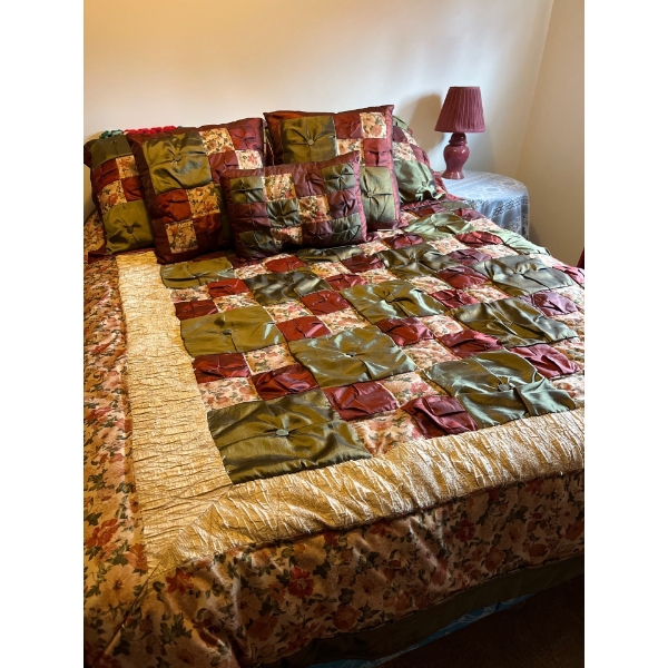  Double size bed with matching quilt, set pillows, table, side lamp, and table and curtains