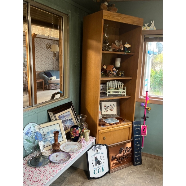 wood cabinet with a number of collectables pictures picture frames. Also sold this one lot.
Includin