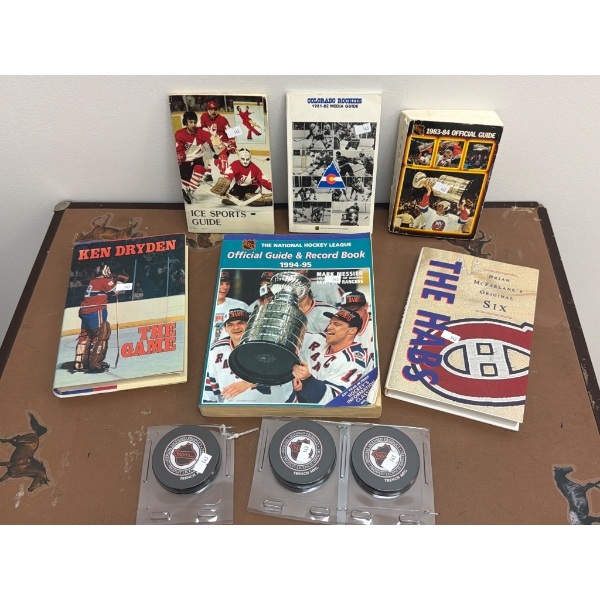 Hockey Memorabilia Including Books and NHL Pucks