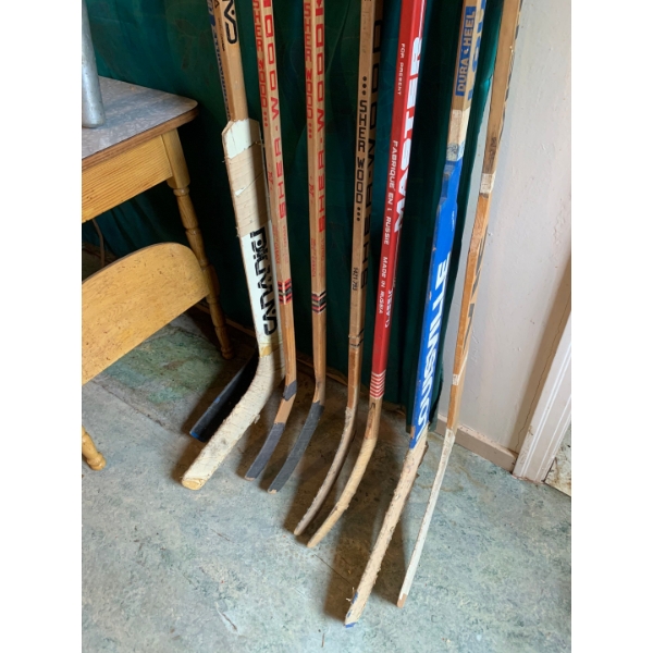1970-1980 collection of made in Canada Goalie and Hockey Sticks with vintage baseball bats 