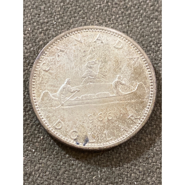 1966 Canadian Silver Dollar Coin Featuring Indigenous Canoe Design